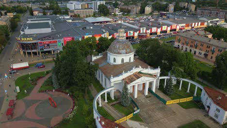 Roman-Catholic-Church-of-Saint-Peter-in-Daugavpils-with-the-view-of-cityscape-and-apartments-in-the-background,-Latvia,-Aerial-View