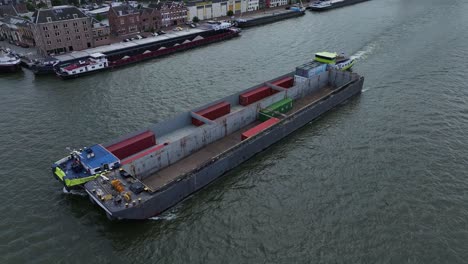 Container-Barge-and-Catamaran-sailing-past-each-other