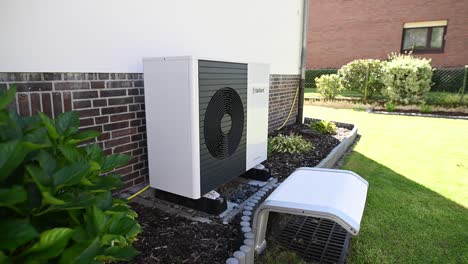A-heat-pump-from-Vaillant-is-installed-on-the-outside-wall-of-a-single-family-house-and-heats-the-building-with-sustainably-produced-electricity