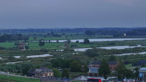 Windmills,-houses,-buildings-and-transportation-at-the-village-of-Kinderdijk,-Netherlands