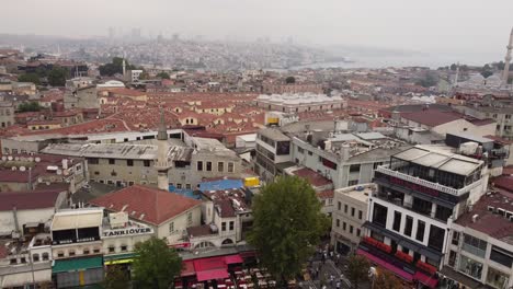 Top-down-view-of-grand-bazaar-with-mosque-and-city-in-the-background
