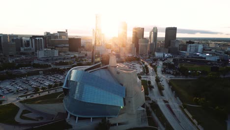 A-Sunset-Reflection-Shining-Golden-Hour-Aerial-View-of-the-Urban-Park-Canadian-Museum-for-Human-Rights-The-Forks-Market-Downtown-Winnipeg-Shaw-Park-Provencher-Bridge-Red-River-in-Manitoba-Canada