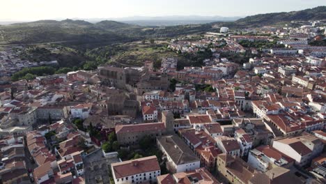 Aerial-orbiting-view-of-Plasencia-cityscape-with-Majestic-New-Cathedral-historic-building,-Spain