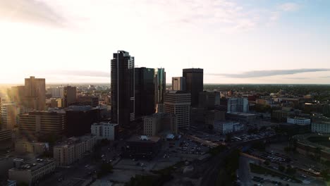 A-Rising-Skyscraper-Sunset-Golden-Hour-Aerial-View-of-the-Urban-Park-Canadian-Museum-for-Human-Rights-The-Forks-Market-Downtown-Winnipeg-Shaw-Park-Provencher-Bridge-Red-River-in-Manitoba-Canada
