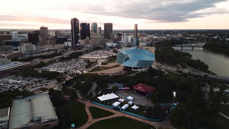 A-Sunset-Golden-Hour-Aerial-View-of-the-Urban-Park-Canadian-Museum-for-Human-Rights-The-Forks-Market-Downtown-Winnipeg-Shaw-Park-Provencher-Bridge-Red-River-in-Manitoba-Canada
