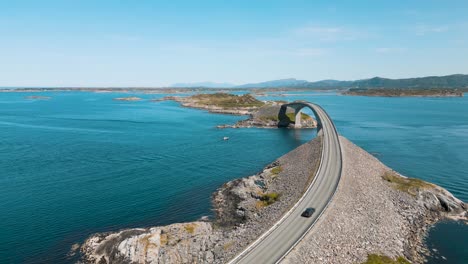Aerial-view-of-a-car-on-Atlantic-Road-also-known-as-”The-Road-in-the-Ocean”-in-Norway