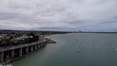 Aerial-Shot-of-Northcote-Point-with-State-Highway-and-Traffic-Along-the-Oneoneroa-Shoal-Bay-in-Auckland,-New-Zealand