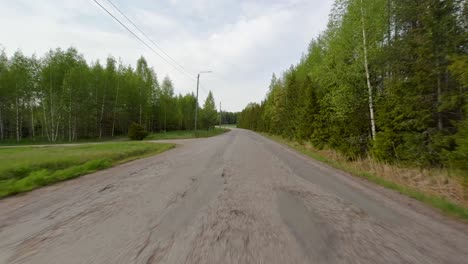 Pov-footage-of-a-car-driving-fast-on-a-beautiful-country-road-in-Finland