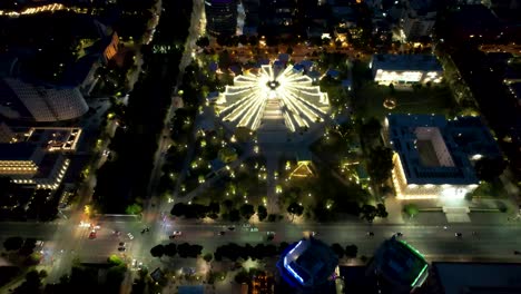 Beautiful-Tirana-Capital,-with-the-Illuminated-Pyramid-of-Tirana,-Lights,-and-Boulevard,-Nighttime-Elegance,-Stunning-Aerial-View