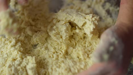 A-person-mixes-dough-with-their-hands