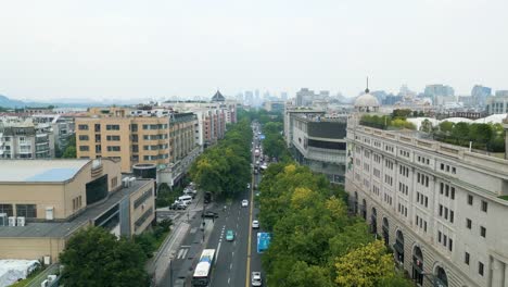 Aerial-revealing-shot-of-the-rush-hour-congestion-on-the-streets-in-downtown-Hangzhou