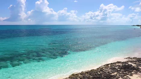 Static-shot-of-the-ocean-and-rocky-shore-on-Exuma-in-the-Bahamas