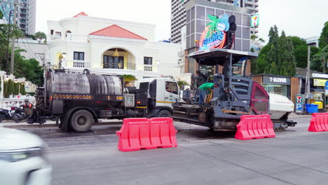 Asphalt-spreader-or-an-asphalt-paver-machine-on-a-road-construction-site