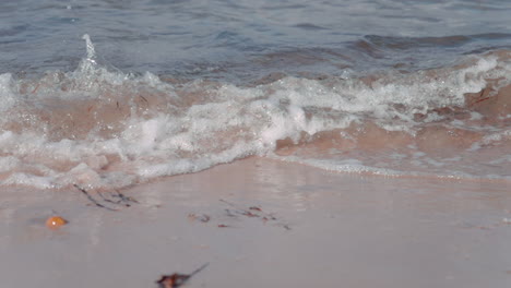 ocean-waves-crashing-on-the-beach-on-a-sunny-day