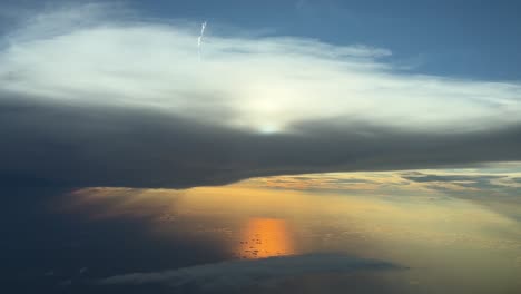 Breathtaking-view-of-a-sunset-over-the-Mediterranean-Sea-,shot-from-an-airplane-cabin-during-a-real-flight