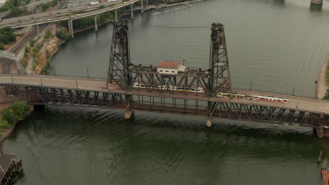 High-circling-aerial-shot-over-steel-bridge-Portland