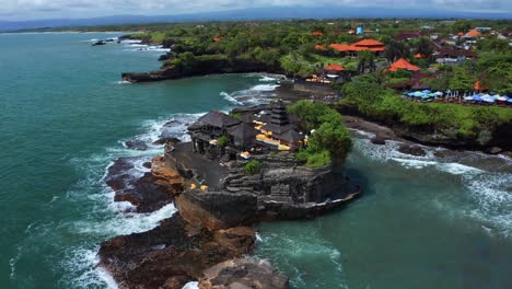 Tanah-Lot-Temple-With-Scenic-Surroundings-In-Bali,-Indonesia---aerial-shot