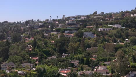 Aerial-view-rising-in-front-of-Bird-Street-luxury-homes-in-Hollywood-Hills-West,-LA