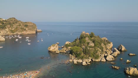 Beautiful-Establishing-Shot-Above-Isola-Bella---Top-Tourist-Destination-in-Southern-Italy