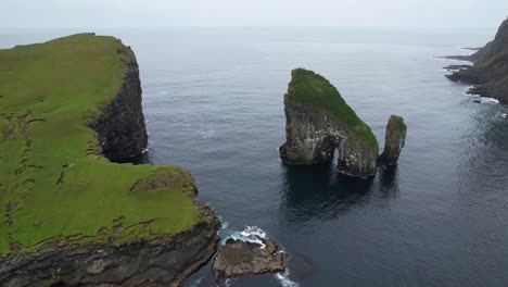 Drangarnir-sea-stacks-and-oceanic-archway-covered-in-lush-green-grass