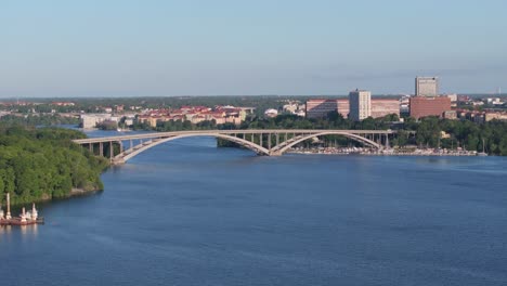 Aerial-view-of-traffic-on-West-Bridge,-connection-across-the-river-in-Stockholm-city,-Sweden