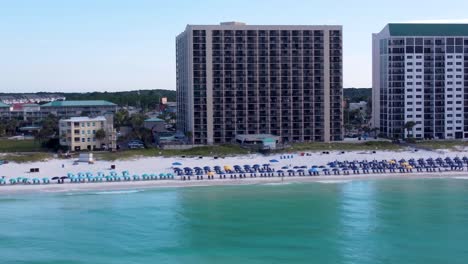 Aerial-view-dolly-shot-of-Gulf-Coast-beach-resorts-and-hotels-on-the-beachfront-near-Henderson-Beach-State-Park-in-Destin-Florida-America