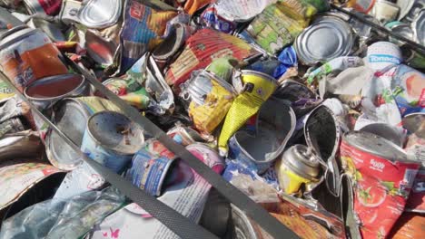 Close-up-of-a-bale-of-compacted-tin-waste-prepared-for-recycling