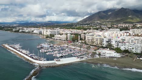 Marbella-Coast-with-Port,-Boulevard-and-Hotels-in-Andalusia,-Spain---Aerial
