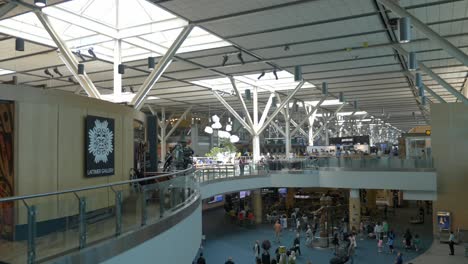 Static-Interior-Shot-of-Vancouver-Airport-Terminal-Hall-with-Travelers