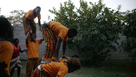 Zambia-Barefeet-theatre-group-creates-a-human-tower,-salutes-audience