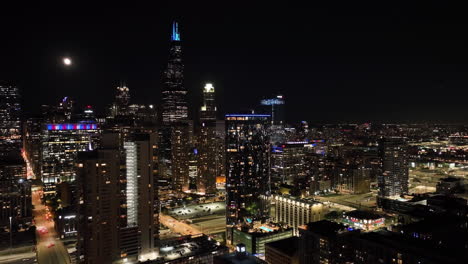Drone-shot-circling-the-illuminated-Chicago-loop-skyline-from-the-west-side
