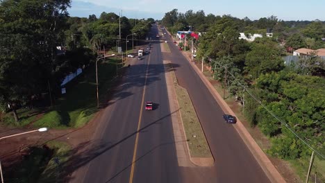 Drone's-Eye-View:-Bustling-Traffic-on-a-Busy-Urban-Road,-rushing-cars-on-a-freeway