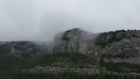 Aerial-View-of-a-Misty-Mountain-on-an-Ominous-Cloudy-Day
