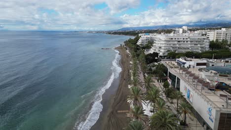 Marbella-Boulevard-and-Hotels-at-the-beach-in-Andalusia,-Spain---Aerial