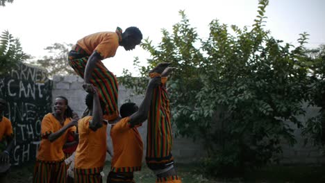 Lusaka's-Barefeet-theatre-group,-human-tower-with-playful-acrobatics