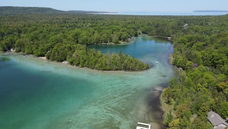 Beauty-of-Fisher-lake-in-Michigan-with-private-property-on-shoreline,-aerial-view