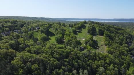 Bay-Mountain-overlooks-Sleeping-Bear-Bay,-has-ski-slopes-and-is-part-of-The-Homestead-Resort,-aerial-view