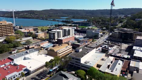 Drone-aerial-pan-shot-of-city-town-landscape-buildings-waterfront-construction-architecture-travel-tourism-Gosford-CBD-NSW-Central-Coast-Australia