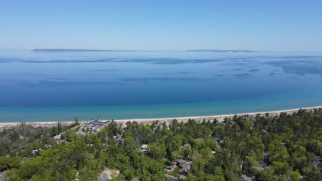 Exotic-sandy-coast-and-small-town-of-Glen-Arbor-near-lake-Michigan,-aerial-view