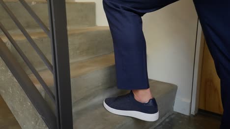 close-up-of-a-mans-shoes-in-business-casual-wear-walking-up-cement-stairs