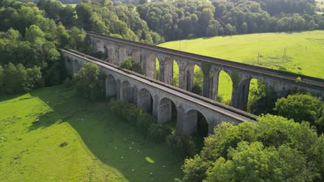 Chirk-Aqueduct-and-railway-Viaduct---aerial-drone-anti-clockwise-flyover,-revealing-canal-and-railway-below---Welsh,-English-border,-Sept-23