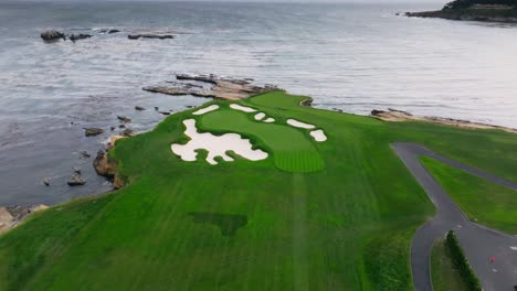 push-in-aerial-drone-shot-of-the-17th-green-at-Pebble-Beach-Golf-Links