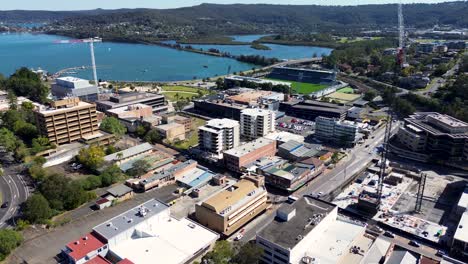 Drone-aerial-landscape-shot-of-city-town-centre-CBD-urban-architecture-buildings-stadium-waterfront-roads-Gosford-Central-Coast-NSW-Australia