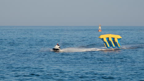 Jetski-Pulling-The-Tourists-Riding-On-An-Inflatable-Flyfish-In-Sokcho-Beach-In-South-Korea