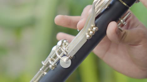 A-close-up-shot-of-how-a-young-performer-is-playing-on-a-clarinet