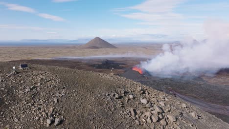 Aerial-view-of-Litli-Hrutur-volcano-erupting-with-plume-of-smoke,-Iceland