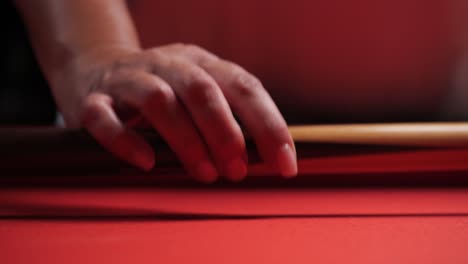 Woman-Walks-Up-To-Red-Billiards-Pool-Table-And-Picks-Up-Cue-Stick-Close-Up