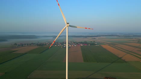 Drone-shot-of-a-slowly-rotating-wind-turbine-propeller