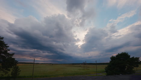 Day-to-night-timelapse,-Morning-night-nature-concept,-Stormy-sky-and-cloud-overhead-timelapse-over-agricultural-land