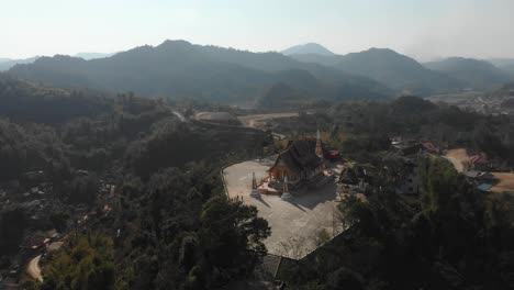 Wide-shot-of-temple-touristic-place-at-laos,-aerial